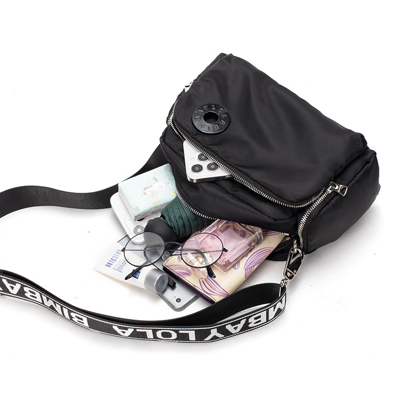 A sleek and lightweight crossbody bag designed for everyday use. Crafted from durable nylon with a soft-touch finish, it combines practicality and minimalist style—perfect for travel, errands, or casual outings