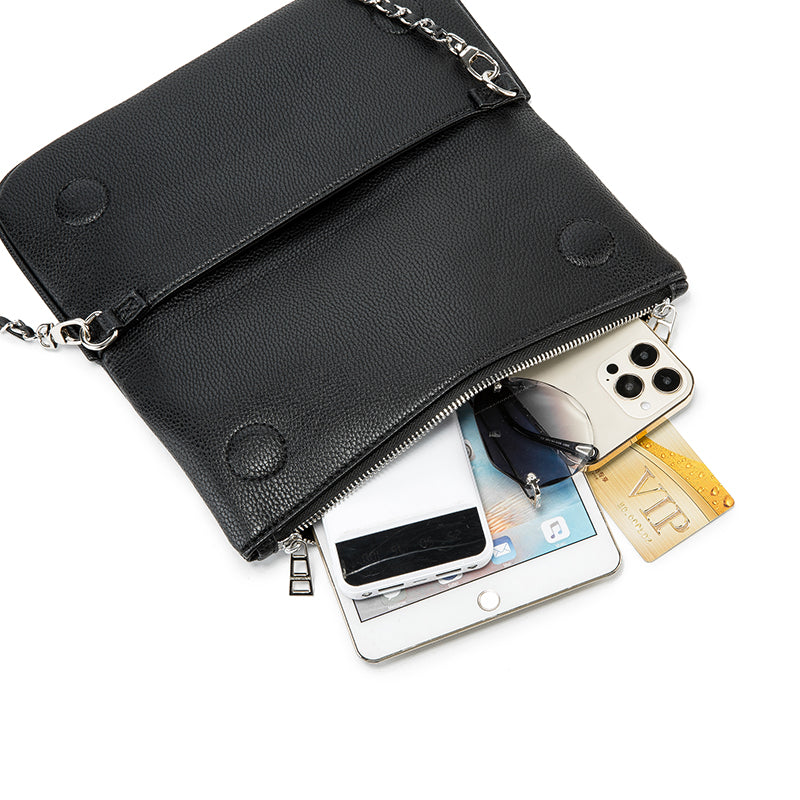 Turn heads wherever you go with this dazzling rhinestone-studded crossbody bag. Designed with a striking symmetrical crystal pattern on premium black textured leather, this piece brings together elegance, glamour, and a bold fashion edge.