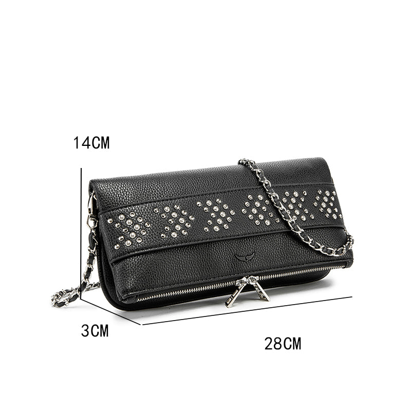 Make a bold statement with this edgy yet elegant studded crossbody bag. Designed for modern fashion lovers, this piece combines textured leather with sparkling metal studs, creating the perfect balance of luxury and street style.