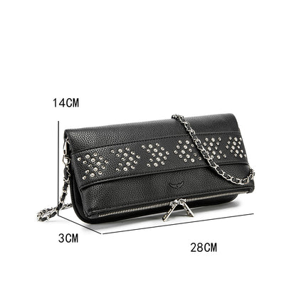 Make a bold statement with this edgy yet elegant studded crossbody bag. Designed for modern fashion lovers, this piece combines textured leather with sparkling metal studs, creating the perfect balance of luxury and street style.