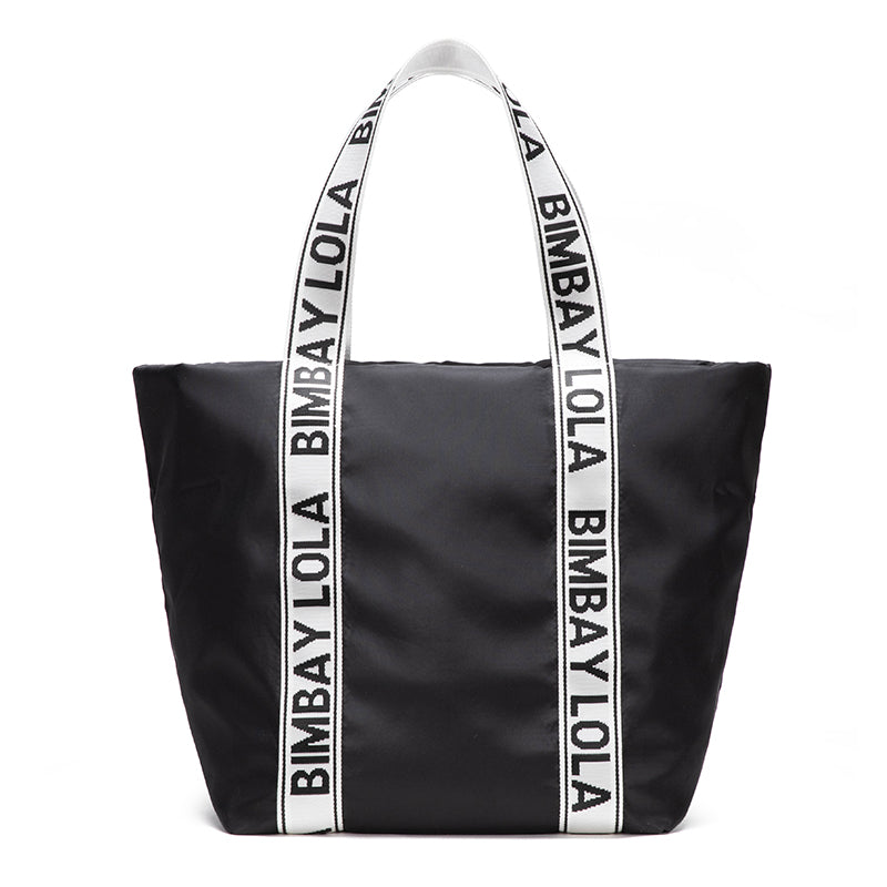 A versatile everyday tote bag designed for style and function. Made from durable lightweight nylon with bold logo shoulder straps, it’s perfect for work, travel, shopping, and daily use.