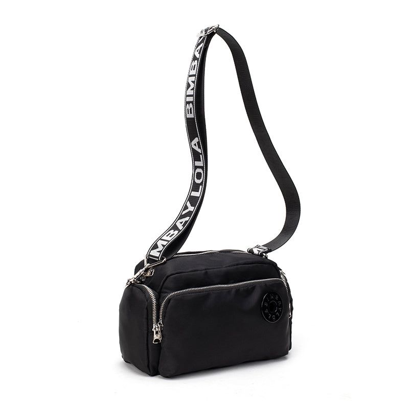 A sleek and lightweight crossbody bag designed for everyday use. Crafted from durable nylon with a soft-touch finish, it combines practicality and minimalist style—perfect for travel, errands, or casual outings