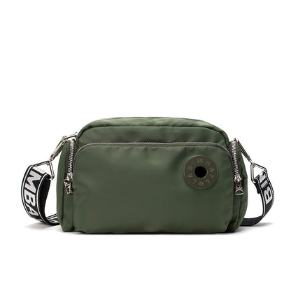 A sleek and lightweight crossbody bag designed for everyday use. Crafted from durable nylon with a soft-touch finish, it combines practicality and minimalist style—perfect for travel, errands, or casual outings
