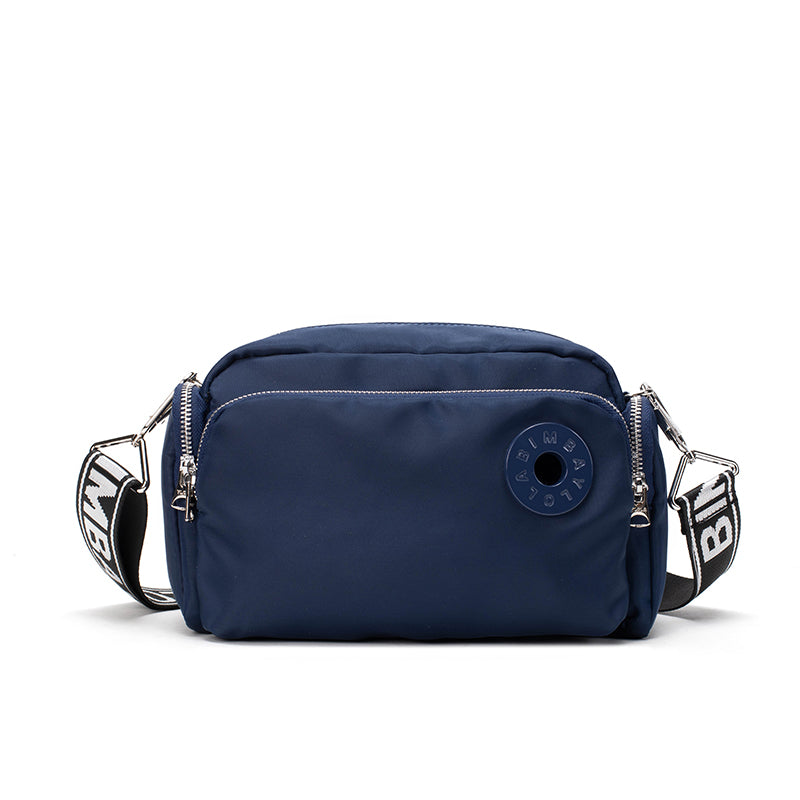 A sleek and lightweight crossbody bag designed for everyday use. Crafted from durable nylon with a soft-touch finish, it combines practicality and minimalist style—perfect for travel, errands, or casual outings