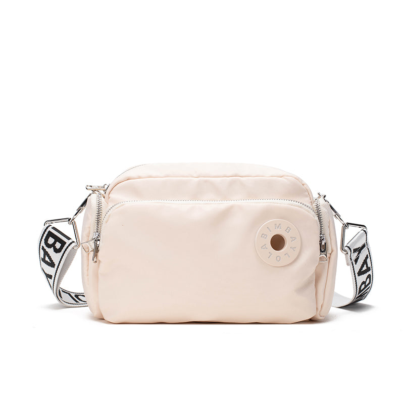 A sleek and lightweight crossbody bag designed for everyday use. Crafted from durable nylon with a soft-touch finish, it combines practicality and minimalist style—perfect for travel, errands, or casual outings