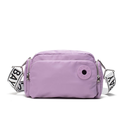 A sleek and lightweight crossbody bag designed for everyday use. Crafted from durable nylon with a soft-touch finish, it combines practicality and minimalist style—perfect for travel, errands, or casual outings