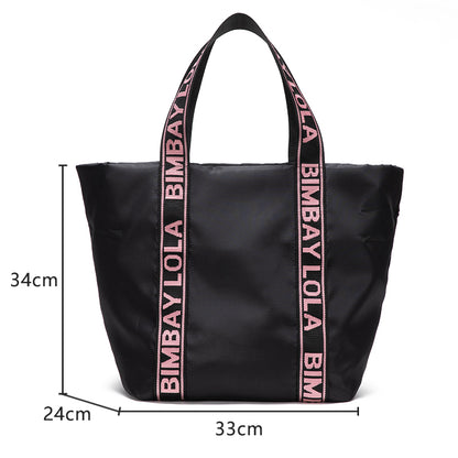 A versatile everyday tote bag designed for style and function. Made from durable lightweight nylon with bold logo shoulder straps, it’s perfect for work, travel, shopping, and daily use.