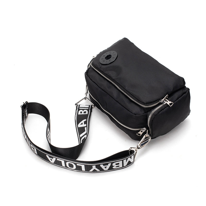 A sleek and lightweight crossbody bag designed for everyday use. Crafted from durable nylon with a soft-touch finish, it combines practicality and minimalist style—perfect for travel, errands, or casual outings