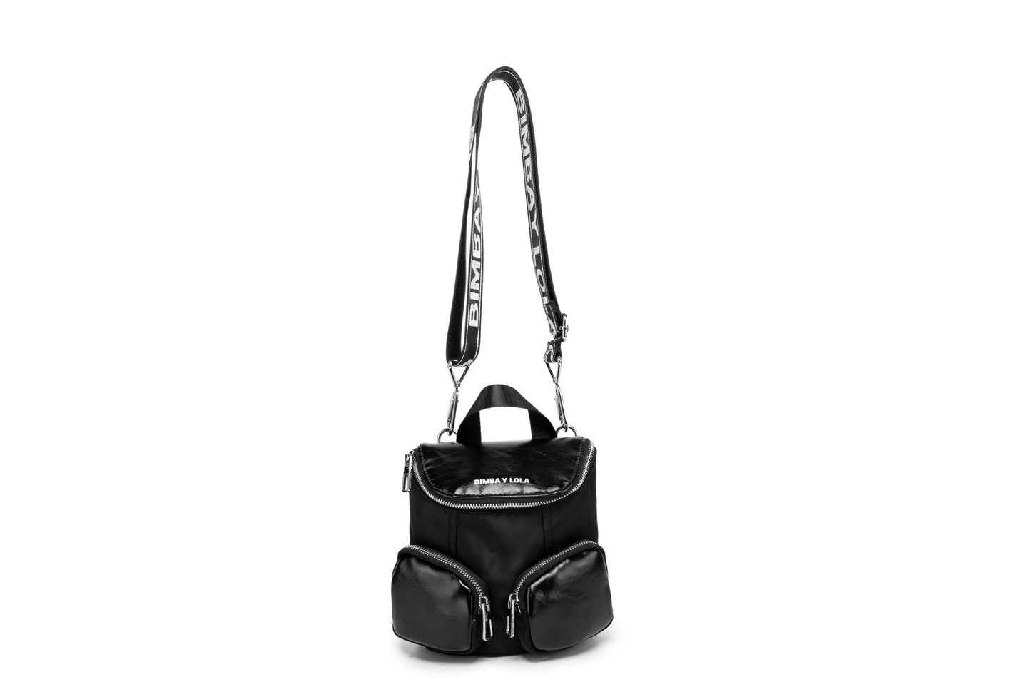 A modern mini backpack-inspired crossbody bag designed for everyday convenience. Crafted from durable black nylon with multiple front pockets and bold logo straps, it combines street-style aesthetics with practical storage