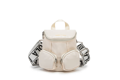A modern mini backpack-inspired crossbody bag designed for everyday convenience. Crafted from durable black nylon with multiple front pockets and bold logo straps, it combines street-style aesthetics with practical storage