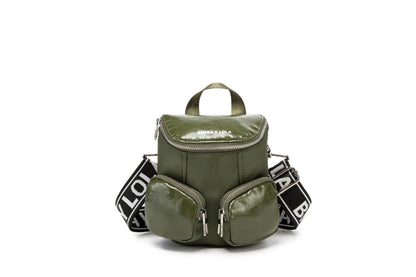 A modern mini backpack-inspired crossbody bag designed for everyday convenience. Crafted from durable black nylon with multiple front pockets and bold logo straps, it combines street-style aesthetics with practical storage