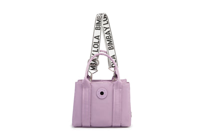 A stylish and structured mini tote designed for everyday elegance. Crafted from durable lightweight nylon in a soft lavender tone, it features dual top handles and a bold adjustable logo strap for versatile carry options