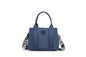 A stylish and structured mini tote designed for everyday elegance. Crafted from durable lightweight nylon in a soft lavender tone, it features dual top handles and a bold adjustable logo strap for versatile carry options