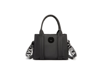 A stylish and structured mini tote designed for everyday elegance. Crafted from durable lightweight nylon in a soft lavender tone, it features dual top handles and a bold adjustable logo strap for versatile carry options