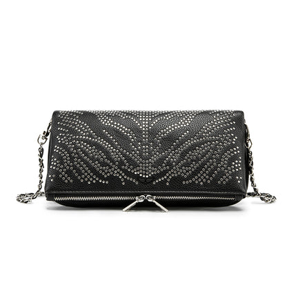 Turn heads wherever you go with this dazzling rhinestone-studded crossbody bag. Designed with a striking symmetrical crystal pattern on premium black textured leather, this piece brings together elegance, glamour, and a bold fashion edge.