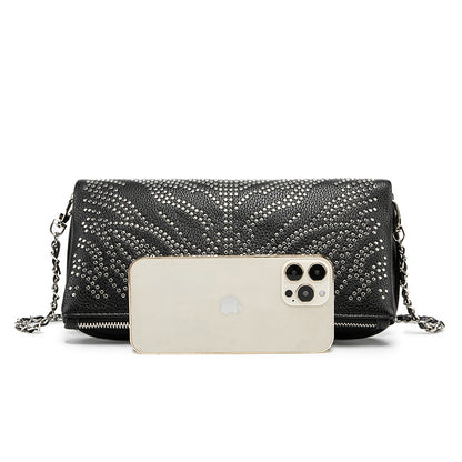 Turn heads wherever you go with this dazzling rhinestone-studded crossbody bag. Designed with a striking symmetrical crystal pattern on premium black textured leather, this piece brings together elegance, glamour, and a bold fashion edge.