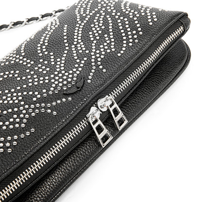 Turn heads wherever you go with this dazzling rhinestone-studded crossbody bag. Designed with a striking symmetrical crystal pattern on premium black textured leather, this piece brings together elegance, glamour, and a bold fashion edge.