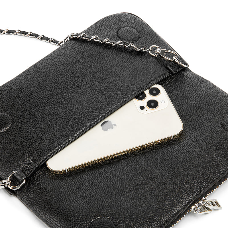 Turn heads wherever you go with this dazzling rhinestone-studded crossbody bag. Designed with a striking symmetrical crystal pattern on premium black textured leather, this piece brings together elegance, glamour, and a bold fashion edge.
