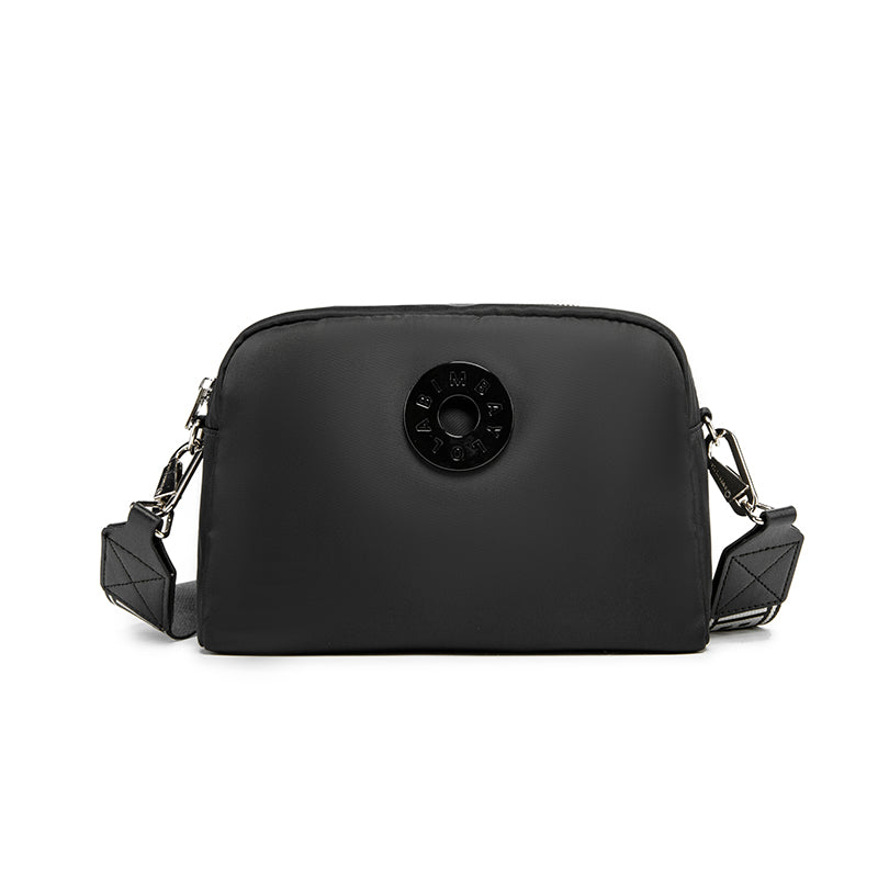 A sleek and functional crossbody bag designed for everyday convenience. Crafted from durable lightweight nylon with a modern minimalist shape, it’s perfect for daily errands, travel, and casual styling