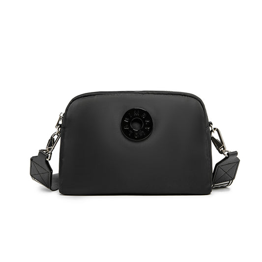 A sleek and functional crossbody bag designed for everyday convenience. Crafted from durable lightweight nylon with a modern minimalist shape, it’s perfect for daily errands, travel, and casual styling