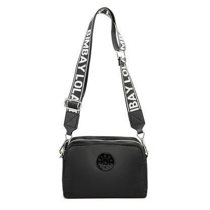 A sleek and functional crossbody bag designed for everyday convenience. Crafted from durable lightweight nylon with a modern minimalist shape, it’s perfect for daily errands, travel, and casual styling
